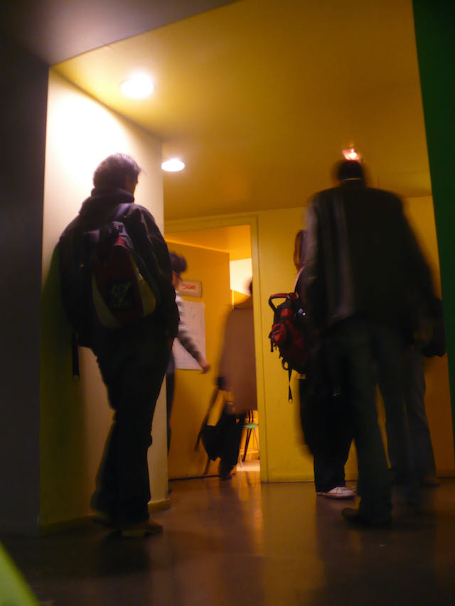 Figure 32: Students entering one of the smaller, windowless philosophy classrooms.
